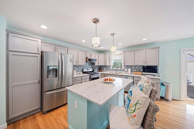61 Hingham Ave, Marshfield, MA 02050 - kitchen featuring stainless steel appliances, a sink, light wood-type flooring, gray cabinetry, and recessed lighting