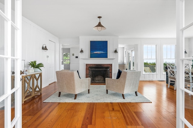 living room featuring a fireplace and hardwood / wood-style flooring