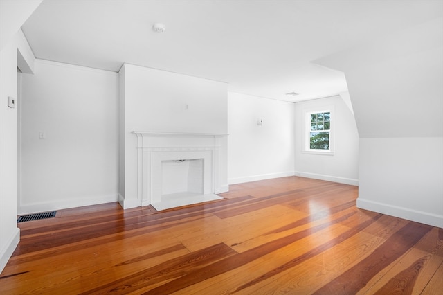 unfurnished living room with hardwood / wood-style flooring