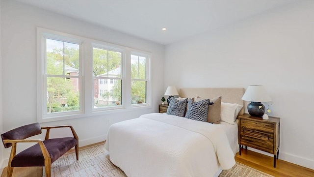 140 Columbia St, Brookline, MA 02446 - bedroom with baseboards, light wood-style flooring, and recessed lighting