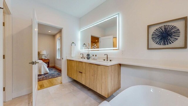 140 Columbia St, Brookline, MA 02446 - ensuite bathroom featuring double vanity and a freestanding bath