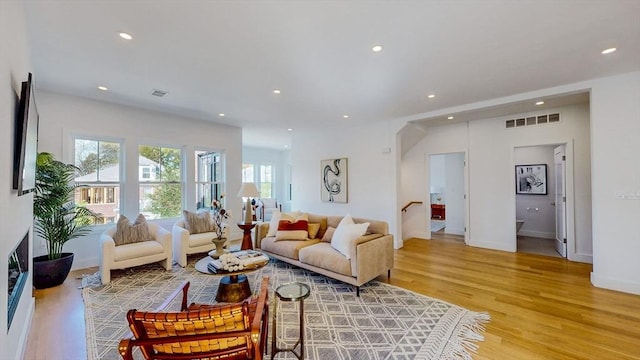 140 Columbia St, Brookline, MA 02446 - living area with plenty of natural light, light wood-style flooring, and recessed lighting