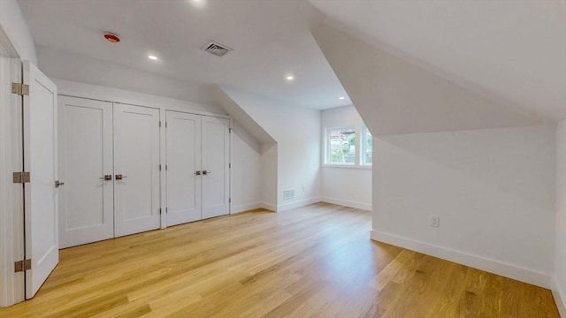 140 Columbia St, Brookline, MA 02446 - additional living space with light wood finished floors, baseboards, and recessed lighting