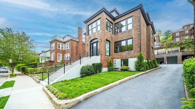 140 Columbia St, Brookline, MA 02446 - view of front of property featuring brick siding