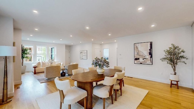 140 Columbia St, Brookline, MA 02446 - dining space featuring light wood-type flooring, recessed lighting, and baseboards