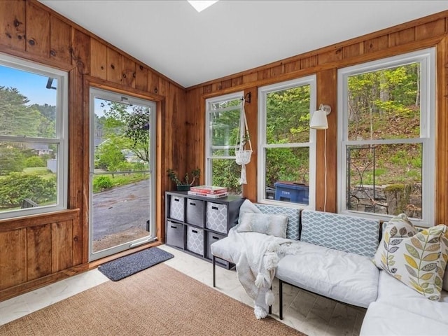sunroom / solarium with vaulted ceiling and wooden walls