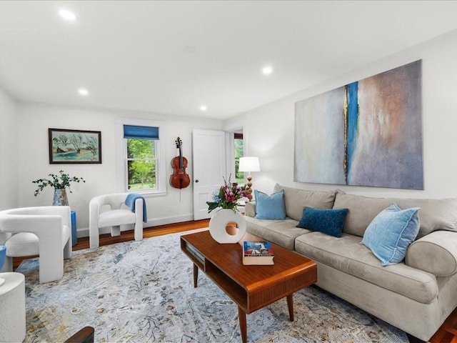 living area with recessed lighting and wood finished floors