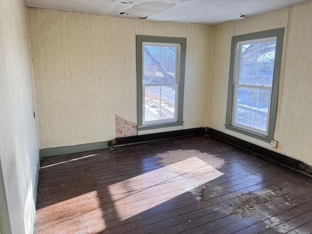 empty room featuring dark hardwood / wood-style flooring