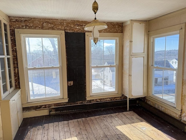 doorway with hardwood / wood-style flooring