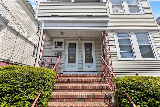 doorway to property featuring covered porch