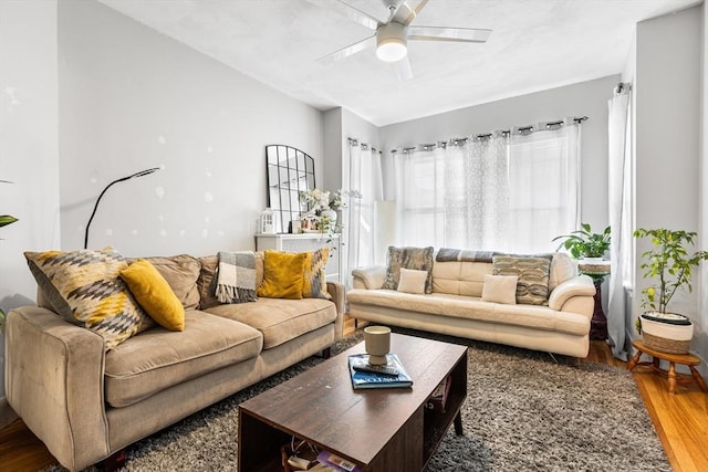 living room featuring wood finished floors and a ceiling fan