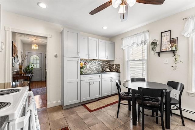 dining room with ceiling fan, baseboards, and recessed lighting