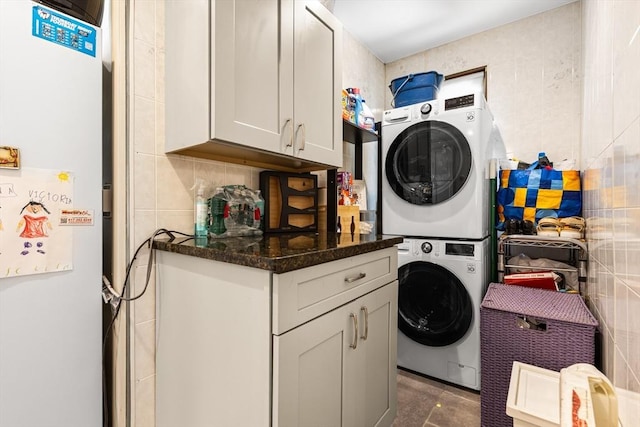 laundry room with stacked washer / drying machine