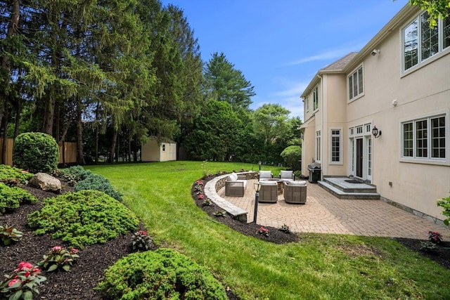 22 Scotney, Newton, MA 02467 - view of green lawn with a patio area, a shed, and an outdoor hangout area