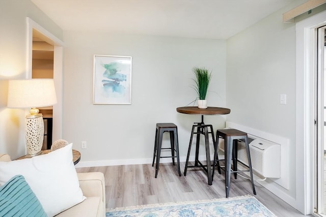sitting room with wood finished floors and baseboards