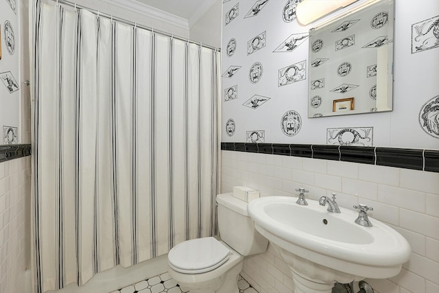 bathroom featuring toilet, tile flooring, tile walls, and sink