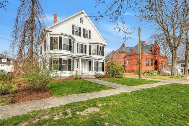 view of front of property with a front lawn