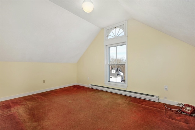 bonus room featuring lofted ceiling, a baseboard heating unit, and dark colored carpet