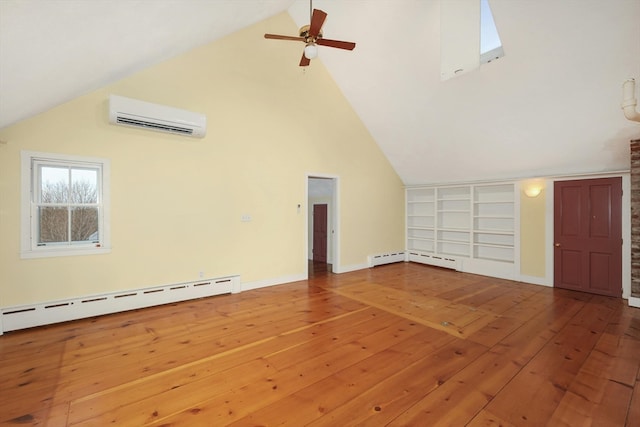 interior space featuring a wall unit AC, baseboard heating, ceiling fan, and hardwood / wood-style floors