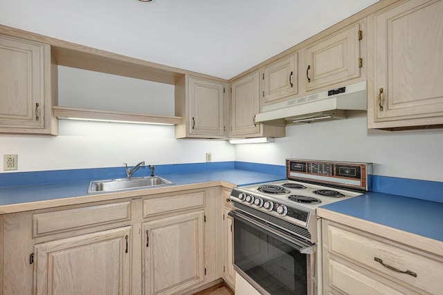 kitchen with sink, light brown cabinets, and white range with electric cooktop