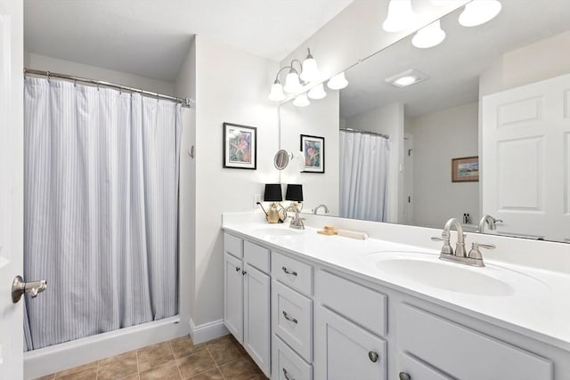 full bath featuring double vanity, tile patterned floors, a shower with shower curtain, and a sink