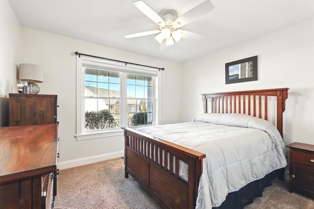 bedroom featuring baseboards, carpet, and a ceiling fan