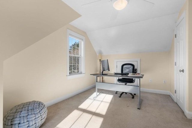 office with vaulted ceiling, light colored carpet, and ceiling fan