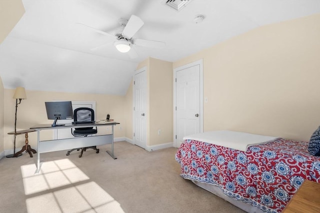 bedroom featuring lofted ceiling, light colored carpet, and ceiling fan