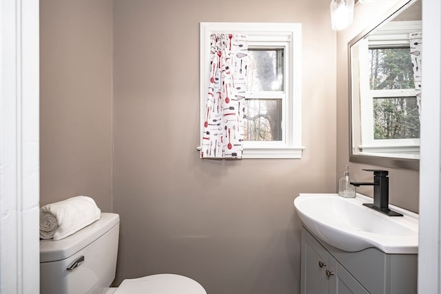 bathroom featuring toilet and vanity