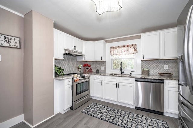 kitchen featuring white cabinets, stainless steel appliances, and sink