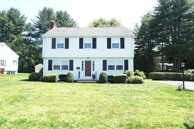 40 Miriam Ln, Lowell, MA 01852 - colonial home with a chimney and a front yard