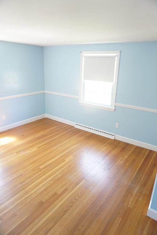 40 Miriam Ln, Lowell, MA 01852 - unfurnished room with a baseboard heating unit and light wood finished floors