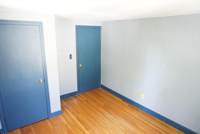 40 Miriam Ln, Lowell, MA 01852 - unfurnished bedroom featuring a closet and light wood-style flooring