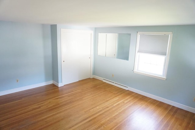 40 Miriam Ln, Lowell, MA 01852 - spare room featuring light wood-type flooring and baseboard heating