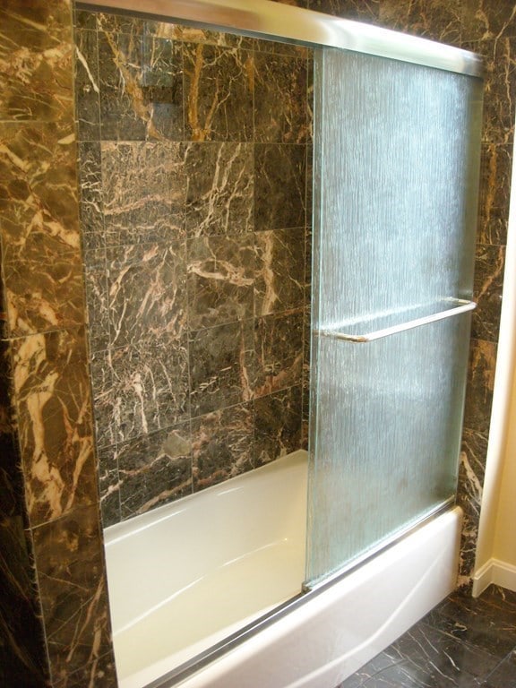 bathroom featuring  shower combination