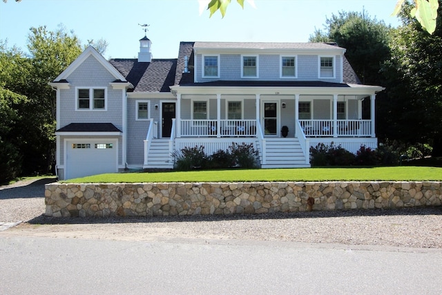 view of front facade featuring covered porch and a garage