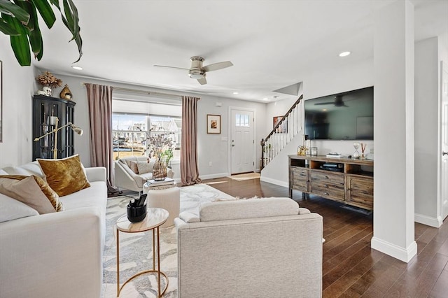 living area with baseboards, dark wood finished floors, stairway, recessed lighting, and a ceiling fan