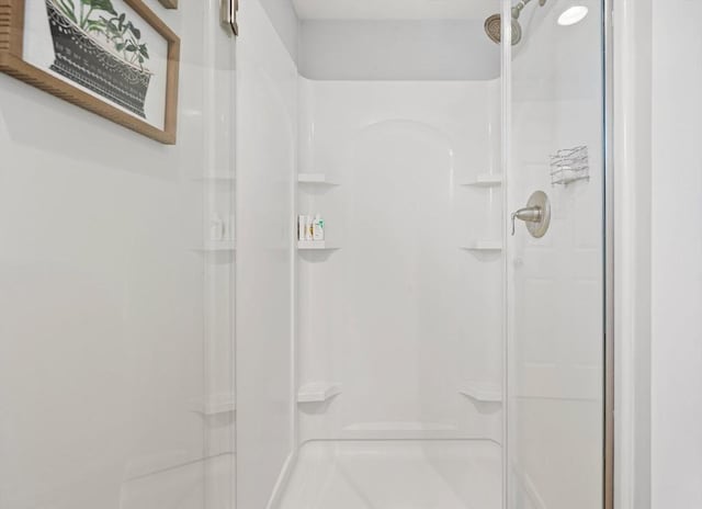 full bath with a shower stall