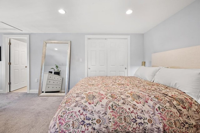 carpeted bedroom with a closet, recessed lighting, and baseboards