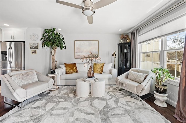 living area featuring recessed lighting, ceiling fan, baseboards, and wood finished floors