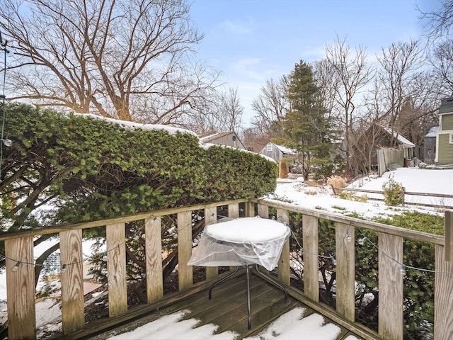 view of snow covered deck