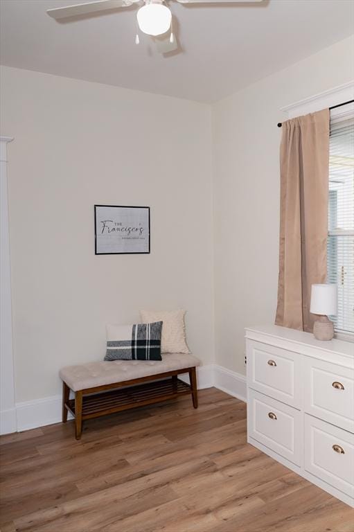 sitting room featuring ceiling fan and light hardwood / wood-style flooring