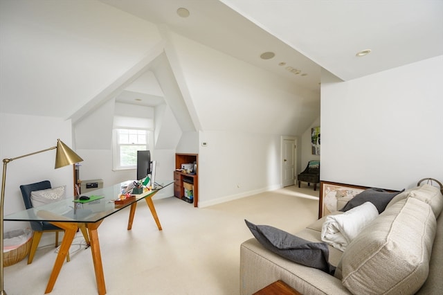 office area featuring vaulted ceiling and light colored carpet