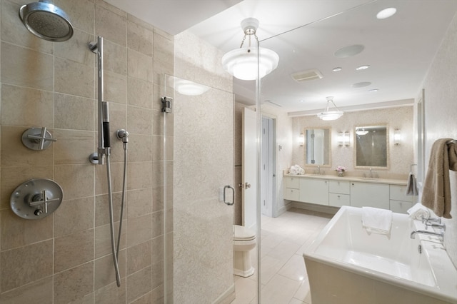 full bathroom with shower with separate bathtub, tile patterned floors, vanity, and toilet