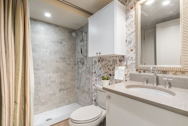 bathroom featuring vanity, toilet, and curtained shower