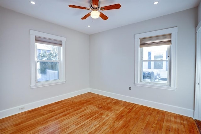 spare room with ceiling fan and light hardwood / wood-style floors