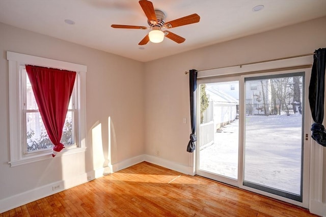 interior space featuring wood-type flooring and ceiling fan