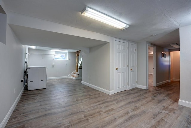 basement featuring light hardwood / wood-style flooring