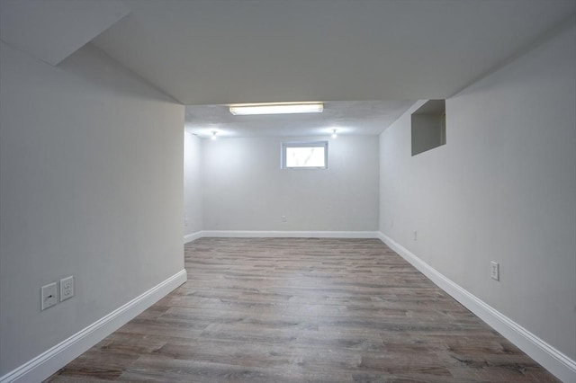 basement featuring light wood-type flooring