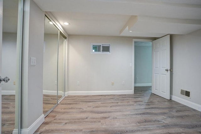 basement featuring light wood-type flooring